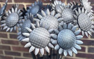 Wrought iron sunflowers arranged for Heart of Kent Hospice’s Sunflower Appeal